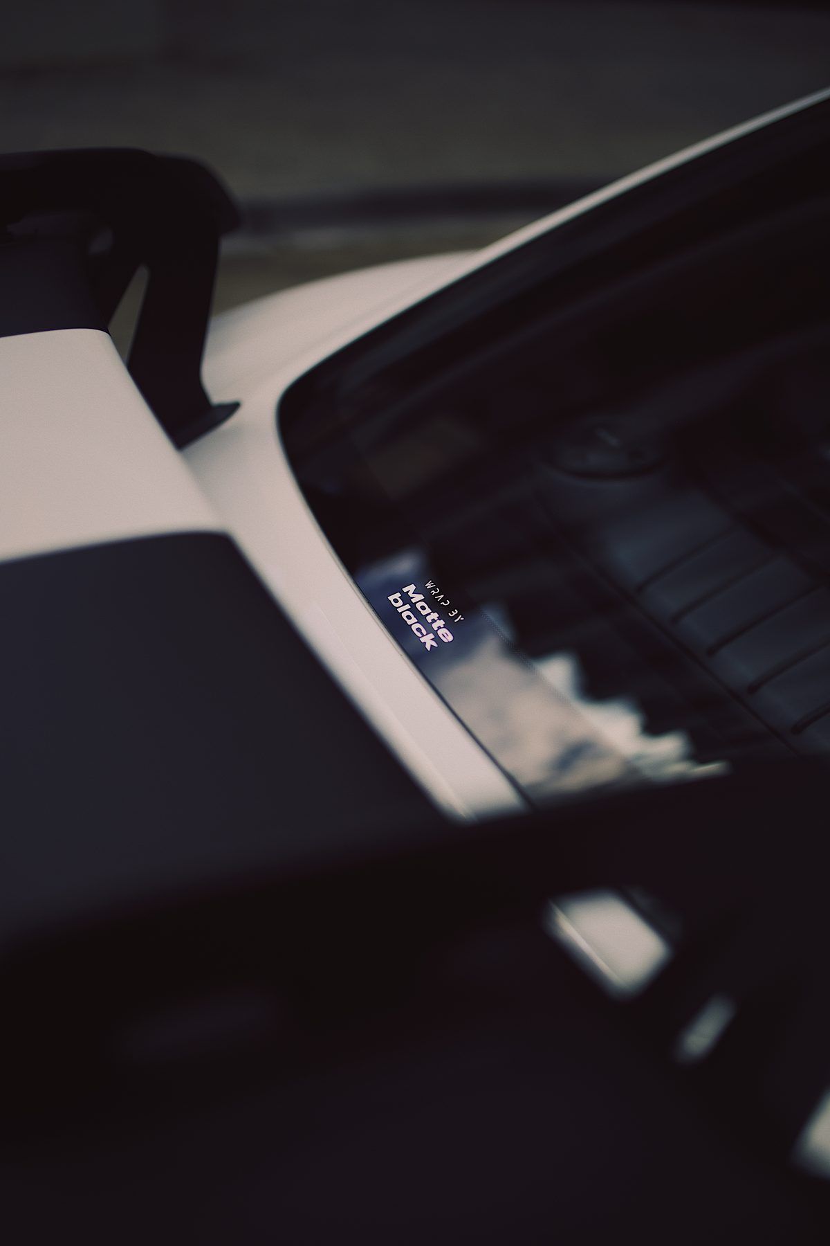 Small "Wrap by Matte Black" sticker on the GT4 RS near the rear wing